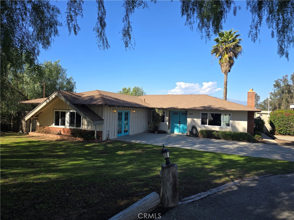 607 Sixth Street Norco, CA 92860 - Photo 31 of 33 a front view of a house with garden