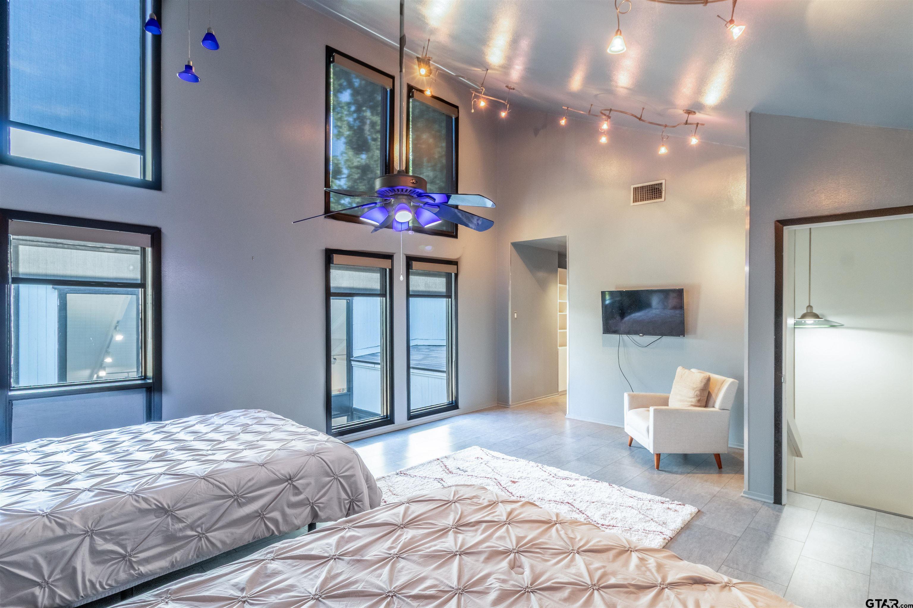 520 East Lake Street Tyler, TX 75701 - Photo 23 of 41 a bedroom with a bed and a mirror