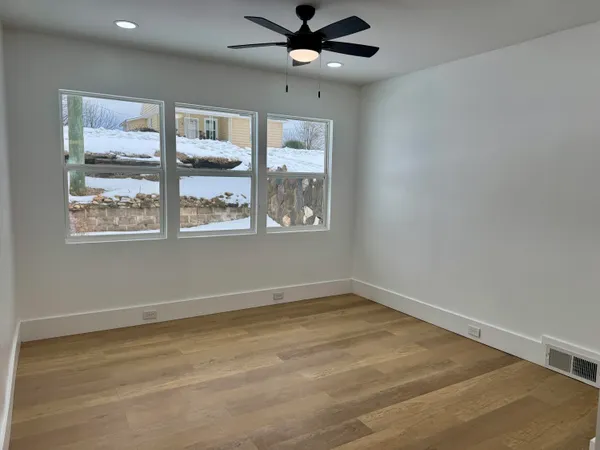 a view of an empty room with a window