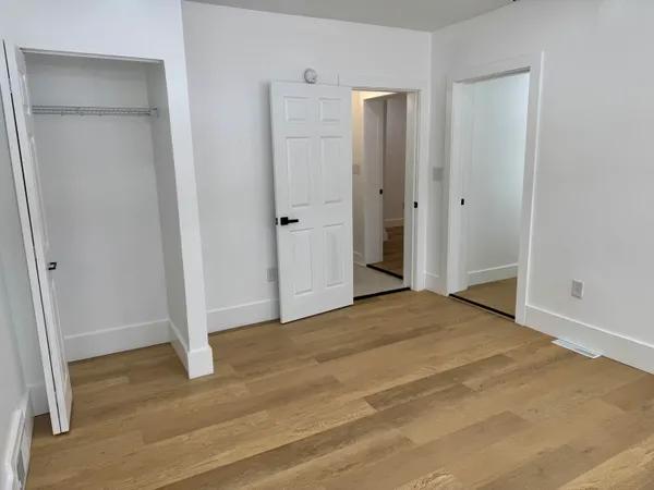 a view of entryway with wooden floor