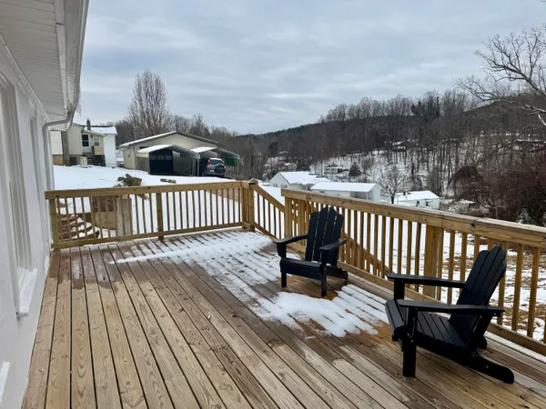 a view of balcony with wooden floor
