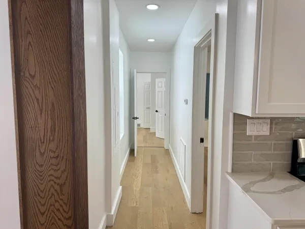 a view of a bathroom from the hallway