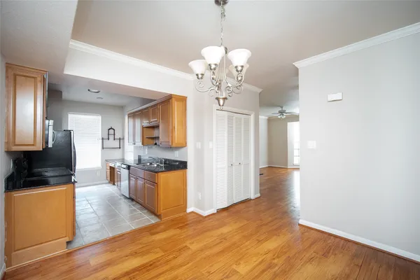 a view of a kitchen with stove and cabinets