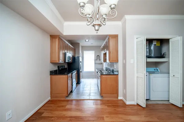 a view of a kitchen from the hallway
