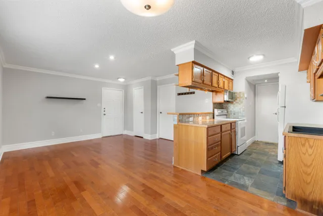 a kitchen that has a sink and a stove