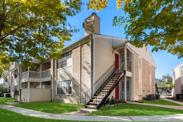 a view of a cars parked in front of a house
