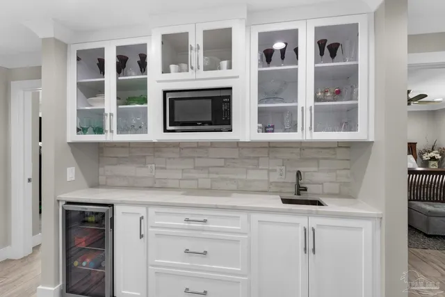 a bathroom with double vanity sink a mirror a and a window