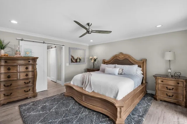 a bedroom with a bed and a tv