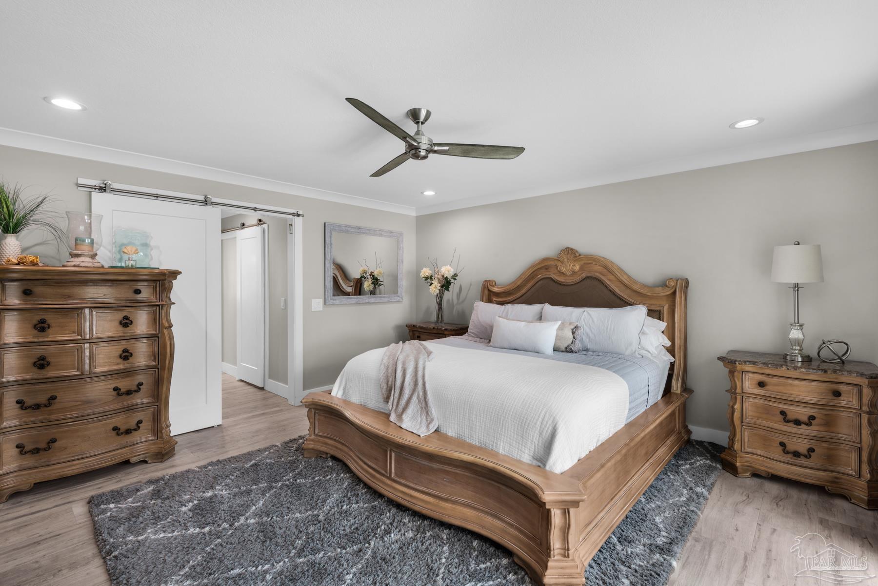 2829 Bay Street Gulf Breeze, FL 32563 - Photo 21 of 69 a bedroom with a bed and a dresser