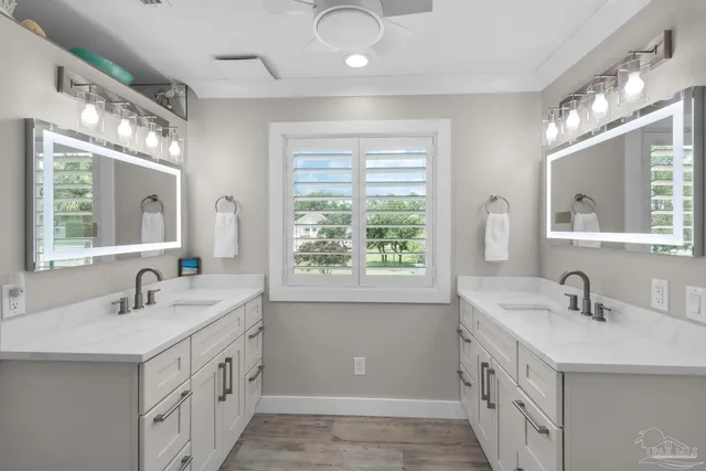 a white toilet sitting next to a bathroom sink