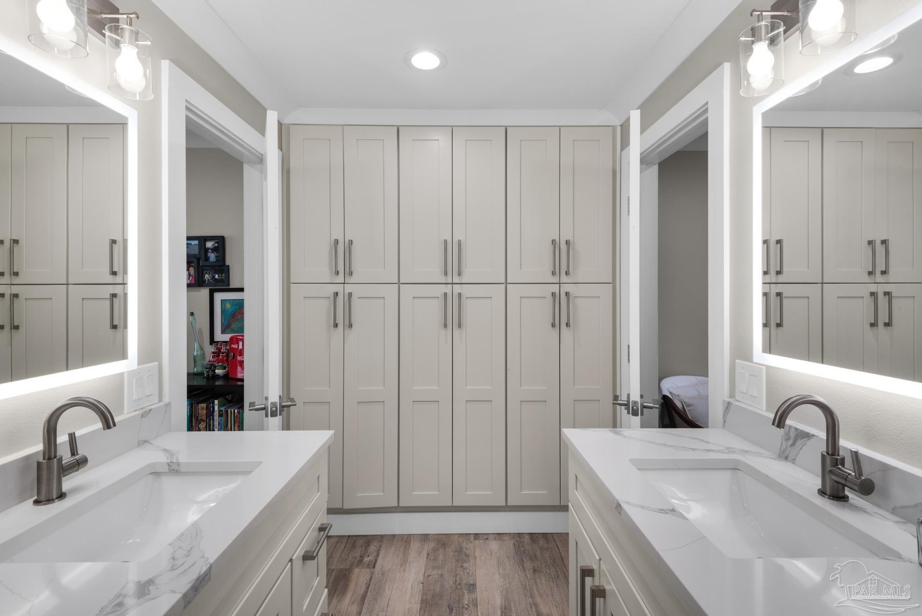 2829 Bay Street Gulf Breeze, FL 32563 - Photo 24 of 69 a bathroom with a double vanity sink a mirror and a bathtub