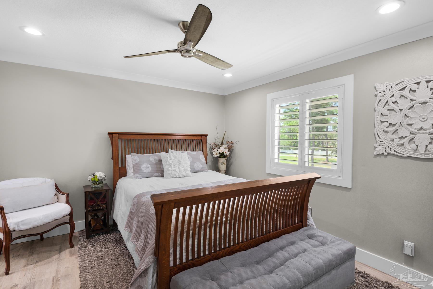 2829 Bay Street Gulf Breeze, FL 32563 - Photo 26 of 69 a bedroom with a bed and a window