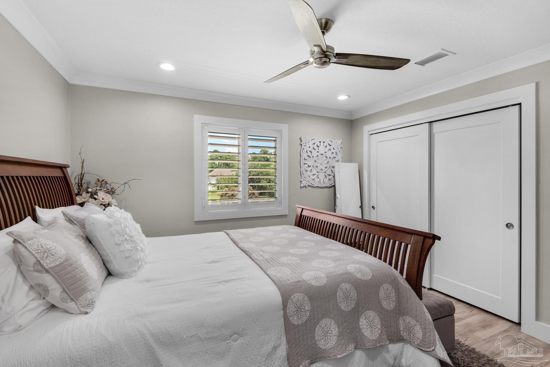 2829 Bay Street Gulf Breeze, FL 32563 - Photo 27 of 69 a bedroom with a bed and a window