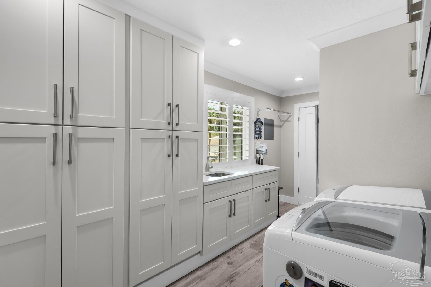 2829 Bay Street Gulf Breeze, FL 32563 - Photo 32 of 69 a kitchen with a sink and cabinets