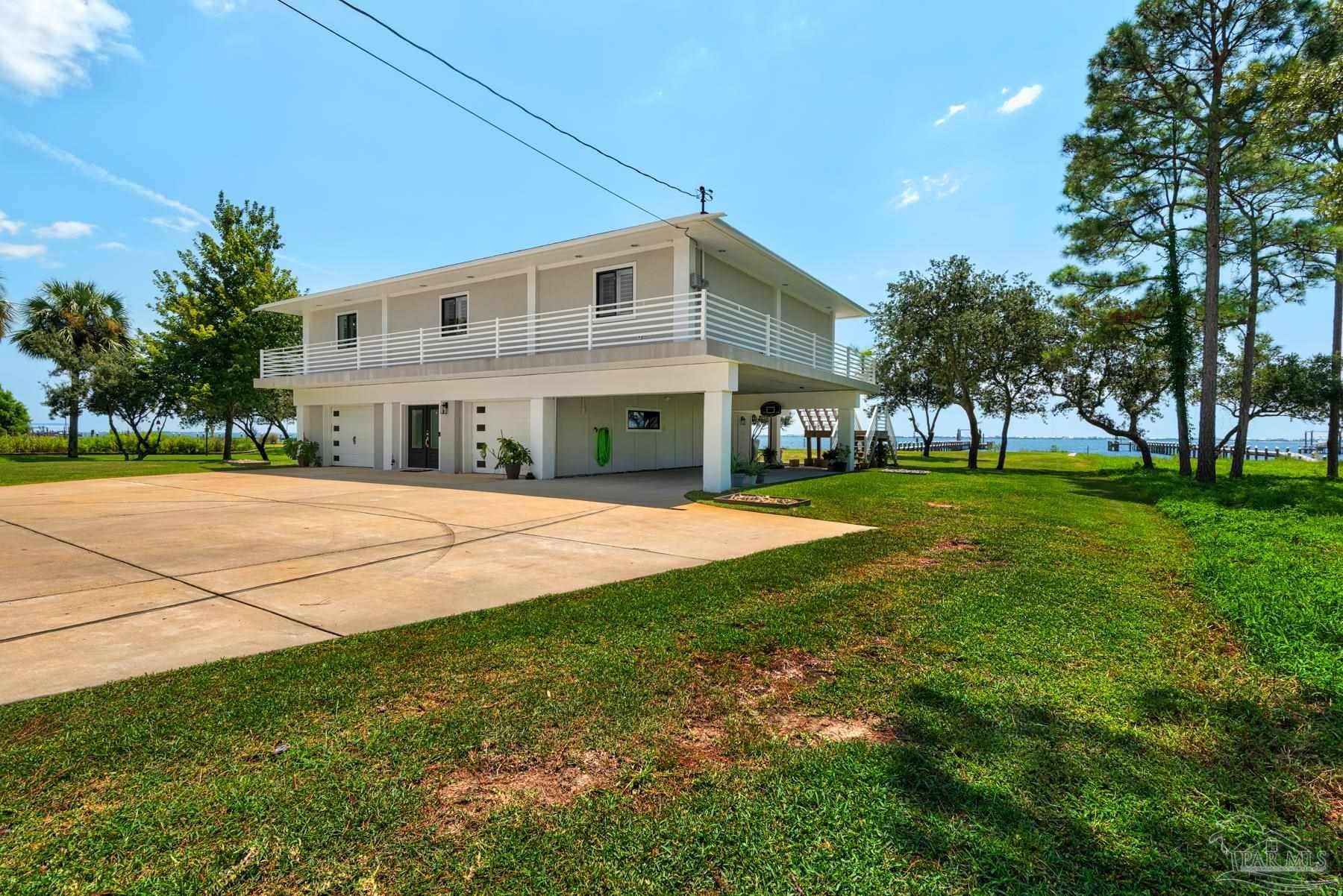 2829 Bay Street Gulf Breeze, FL 32563 - Photo 38 of 69 a view of house with yard and green space