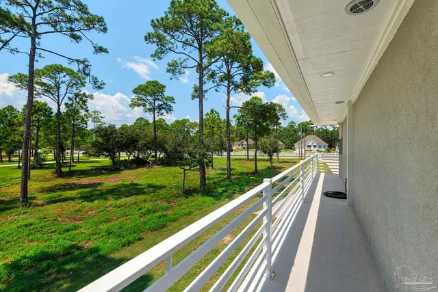 a view of a swimming pool with a yard