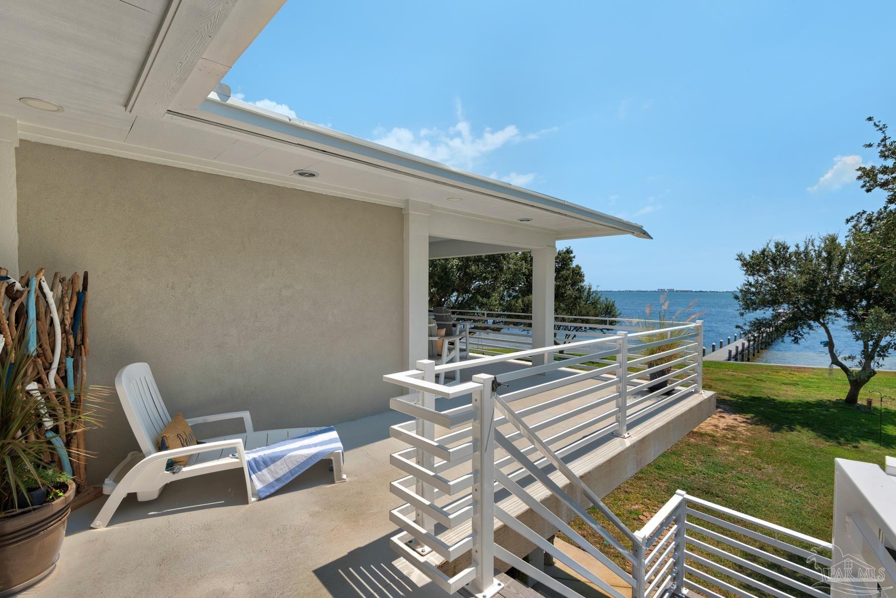 2829 Bay Street Gulf Breeze, FL 32563 - Photo 50 of 69 a view of a patio with table and chairs and potted plants