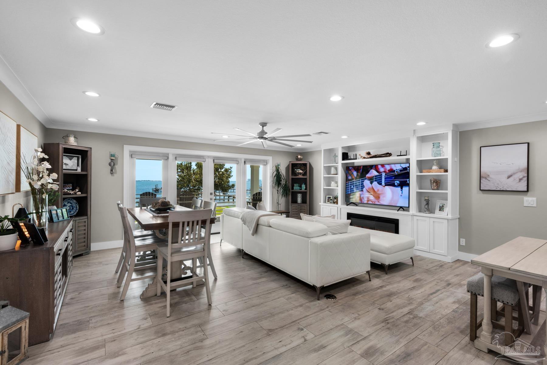 2829 Bay Street Gulf Breeze, FL 32563 - Photo 6 of 69 a living room with furniture and a flat screen tv