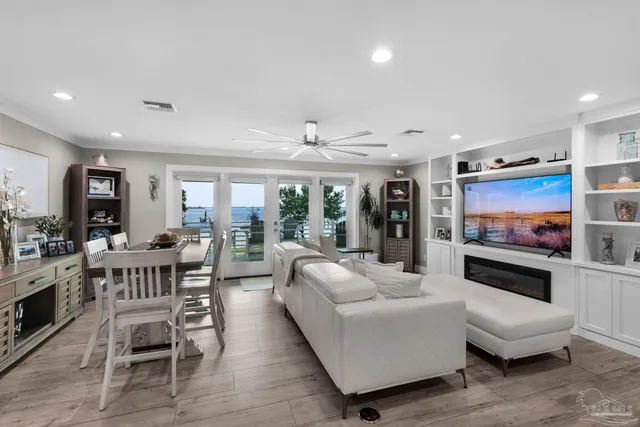 a view of a livingroom with furniture and a window