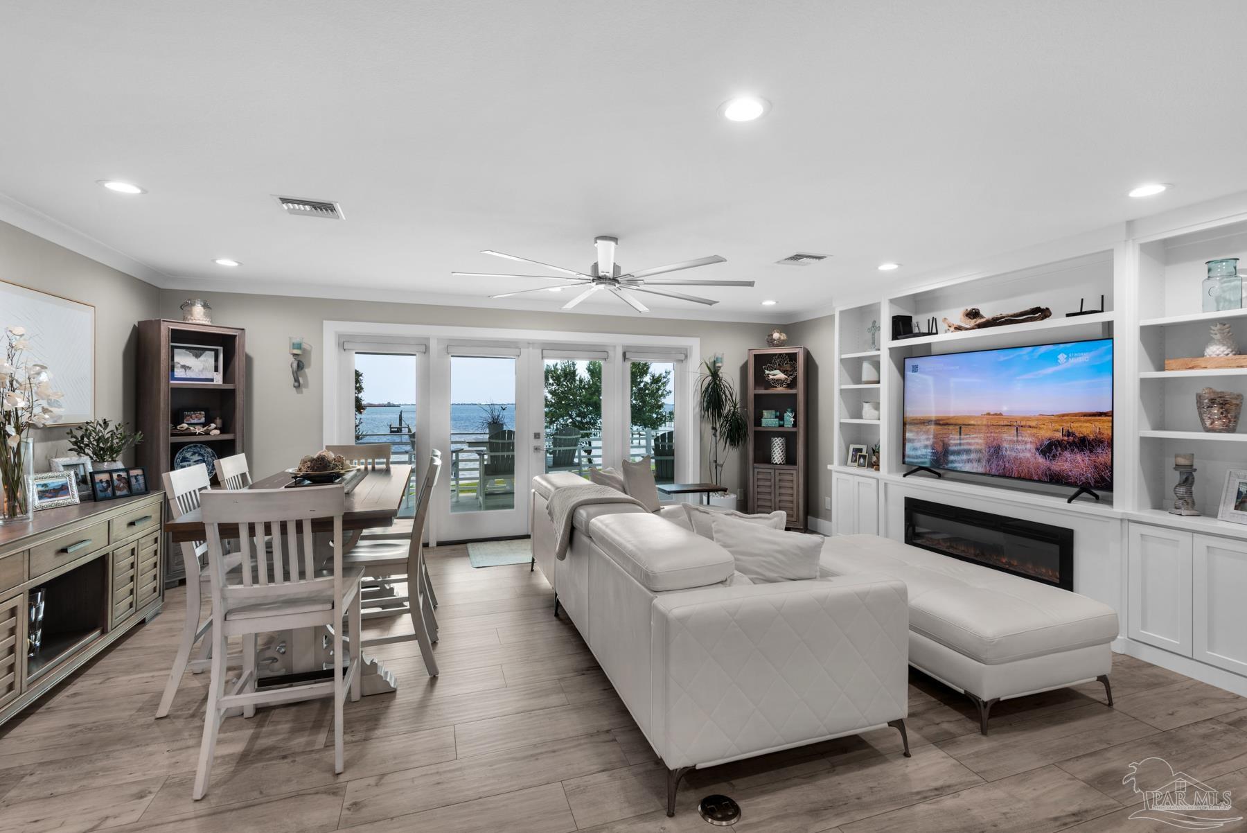 2829 Bay Street Gulf Breeze, FL 32563 - Photo 7 of 69 a living room with furniture and a flat screen tv