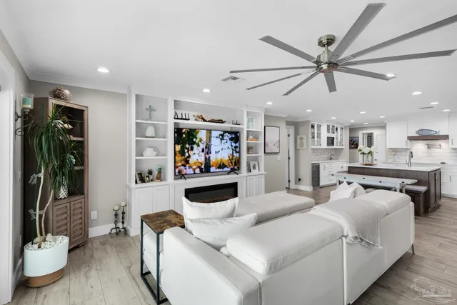 a kitchen with granite countertop a sink a counter top space and living room