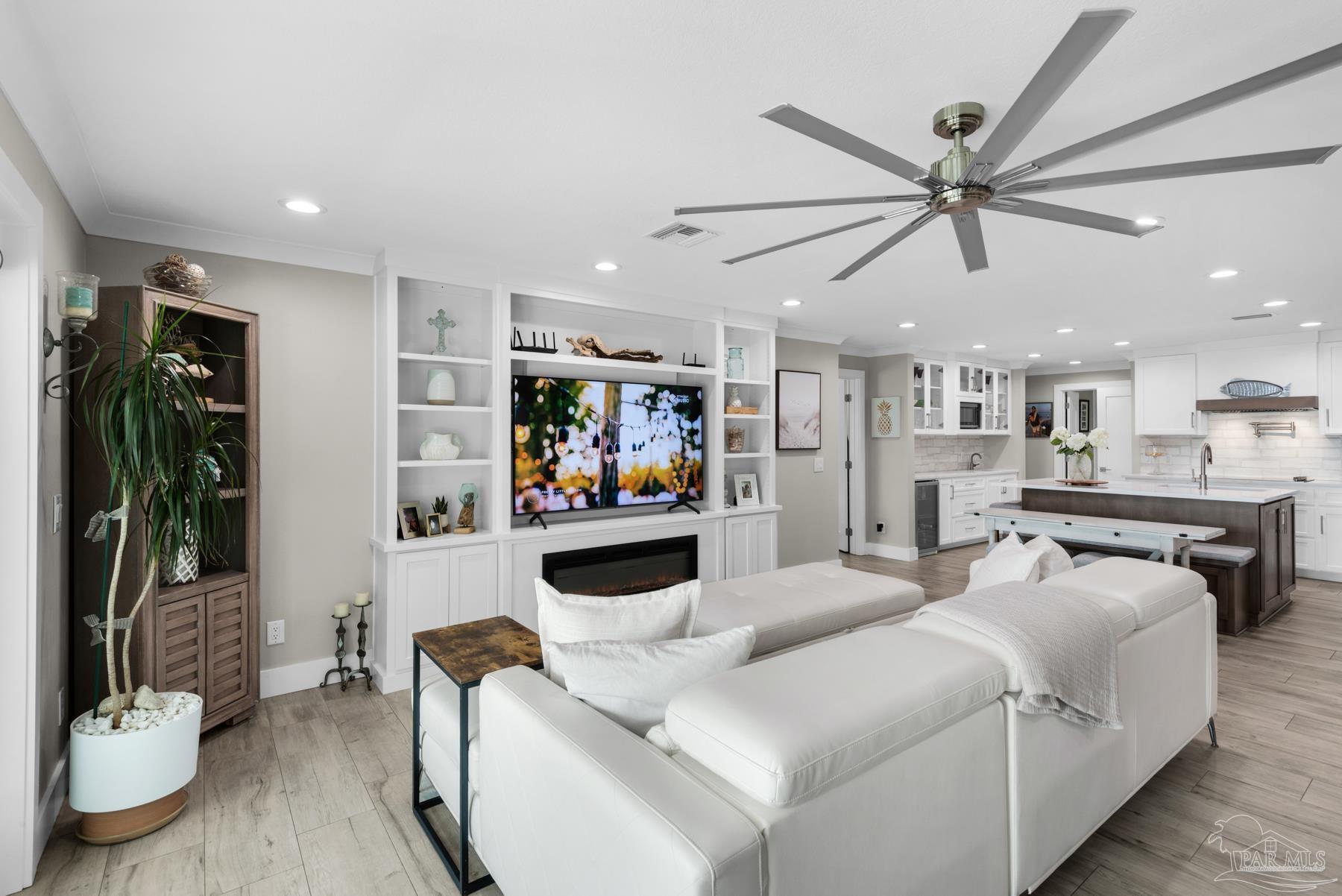 2829 Bay Street Gulf Breeze, FL 32563 - Photo 9 of 69 a living room with furniture and a flat screen tv