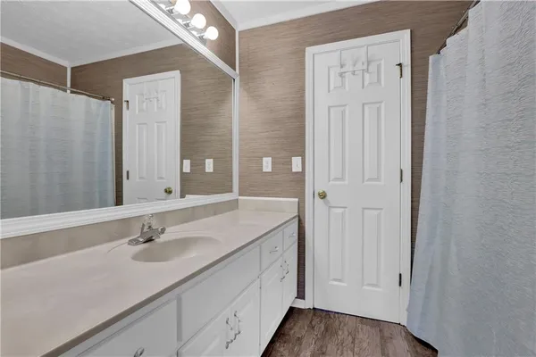 a bathroom with a double vanity sink and mirror