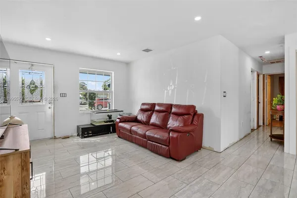 a living room with furniture and a couch
