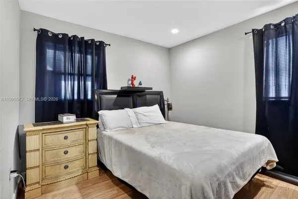 a bed room with a bed and a window