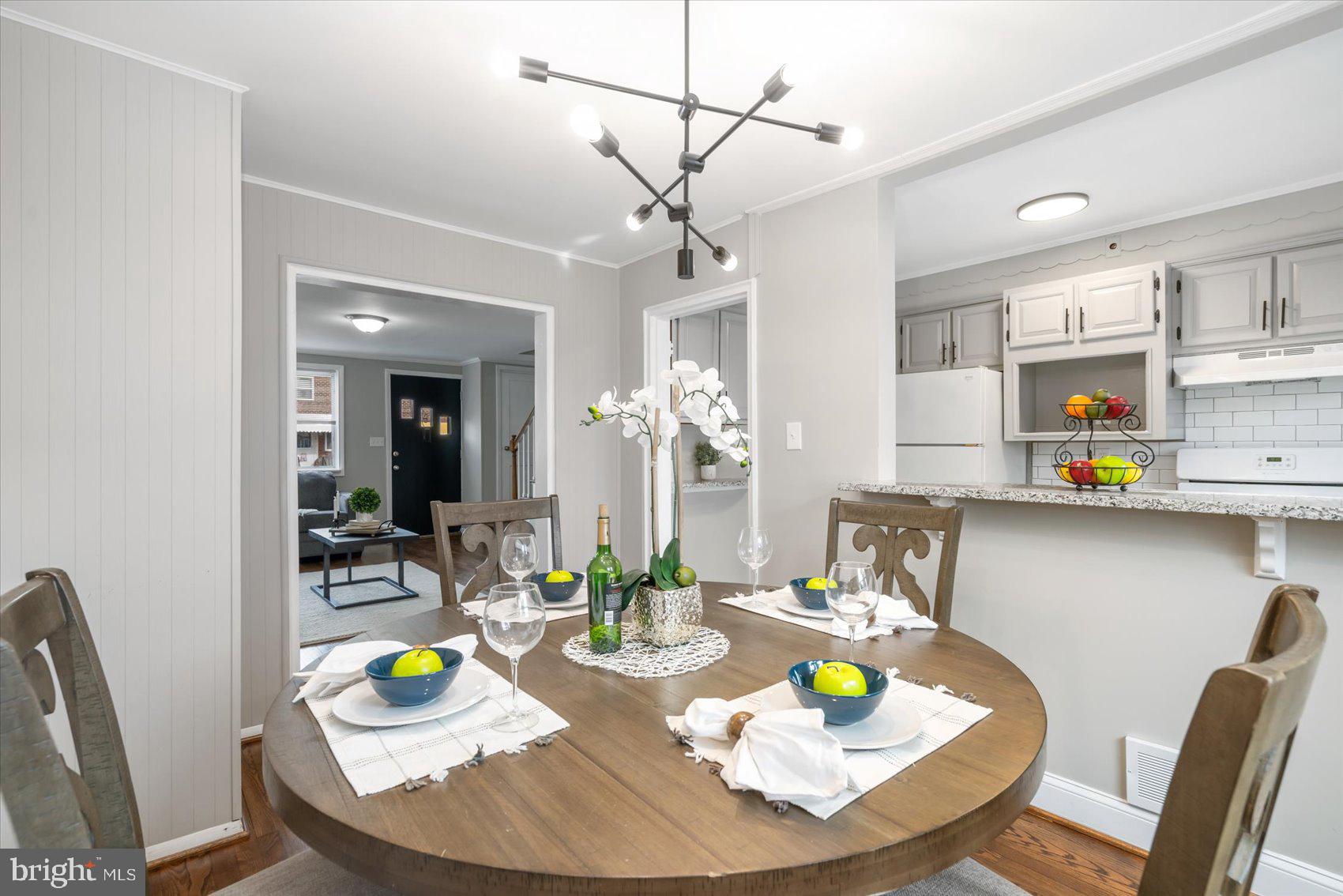 4107 Rokeby Road Baltimore, MD 21229 - Photo 8 of 35 Eat in kitchen with modern light fixture