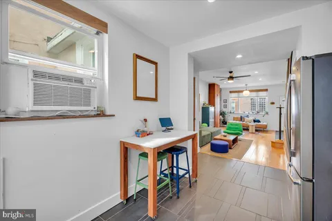 a kitchen with stainless steel appliances granite countertop a refrigerator a stove and a sink