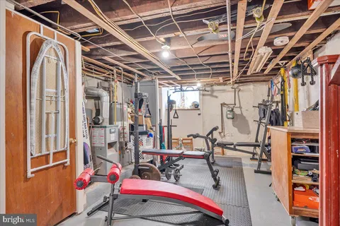 a view of storage and utility room with stairs