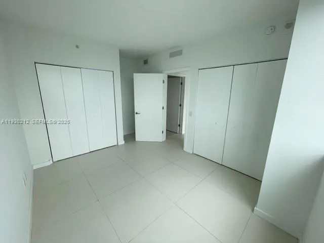 a living room with furniture window and flat screen tv