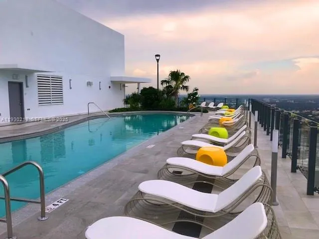 a view of a swimming pool with a lounge chairs