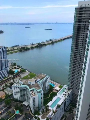 a bathroom with a sink mirror and window