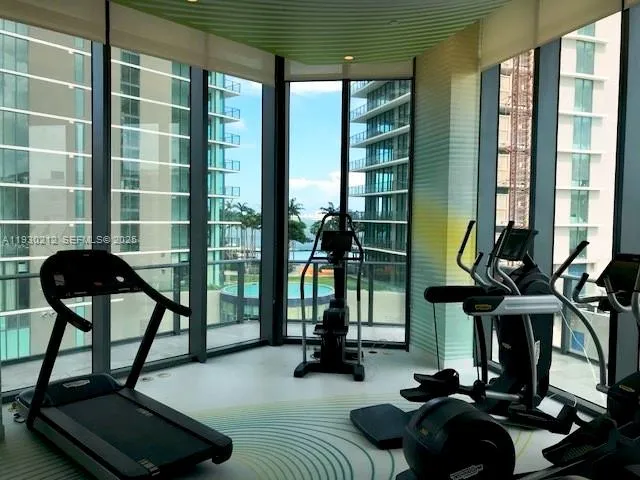 a view of swimming pool with outdoor seating and yard