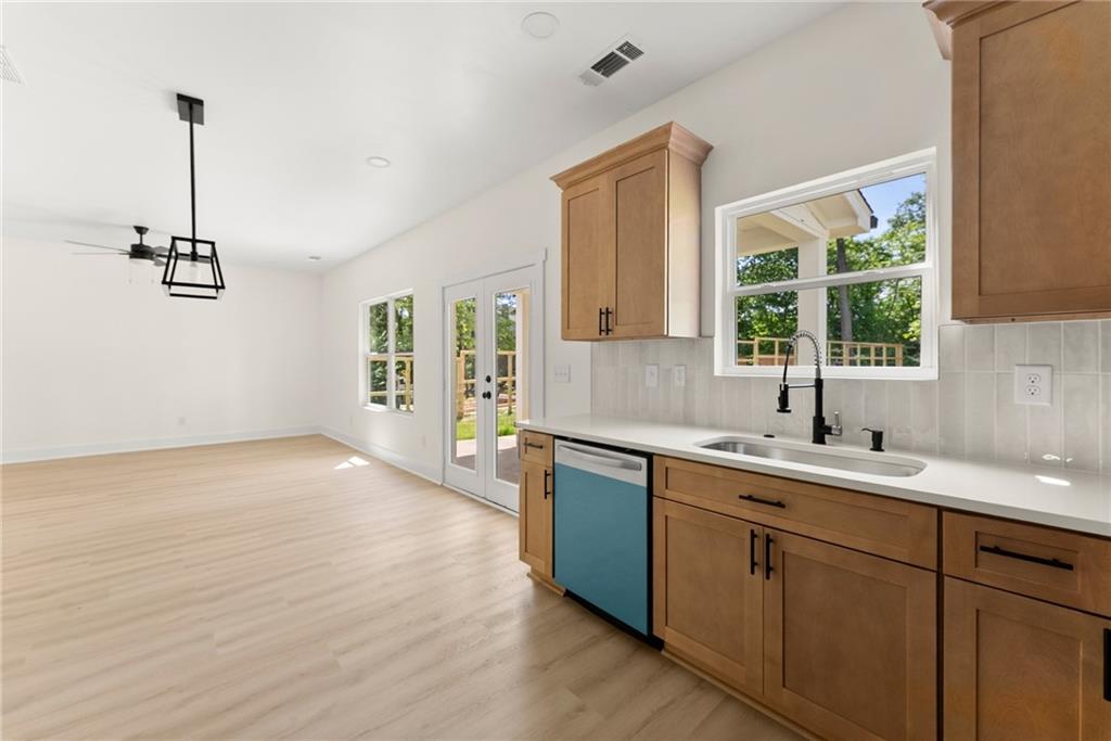 172 Llewellyn Street Clarkesville, GA 30523 - Photo 17 of 49 a kitchen with a sink a window and appliances