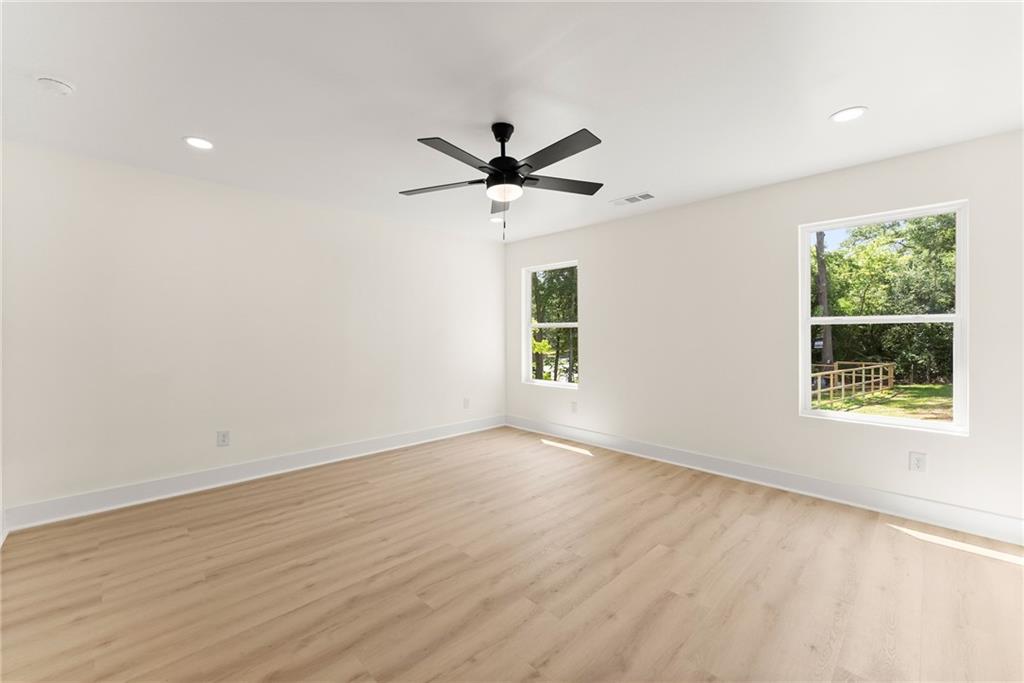 172 Llewellyn Street Clarkesville, GA 30523 - Photo 19 of 44 wooden floor in an empty room with a window