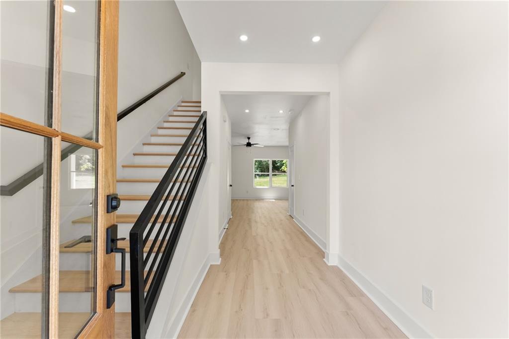 172 Llewellyn Street Clarkesville, GA 30523 - Photo 2 of 44 a view of a hallway with wooden floor and staircase