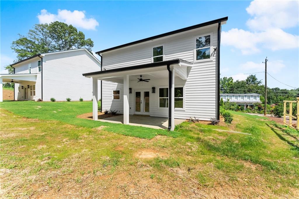 172 Llewellyn Street Clarkesville, GA 30523 - Photo 34 of 44 a view of a house with backyard and porch