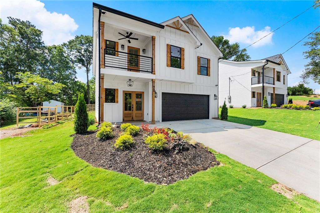 172 Llewellyn Street Clarkesville, GA 30523 - Photo 4 of 49 a front view of a house with garden