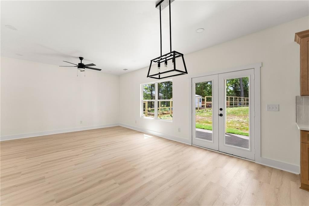 172 Llewellyn Street Clarkesville, GA 30523 - Photo 6 of 44 a view of a room with window wooden floor and front door