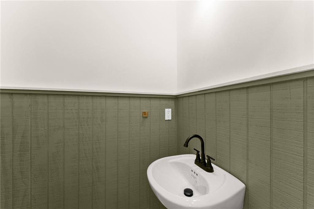 172 Llewellyn Street Clarkesville, GA 30523 - Photo 8 of 49 a bathroom with a sink and mirror