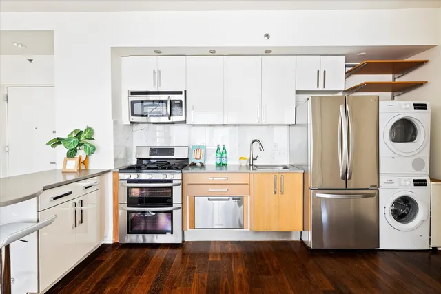 a view of a sink and a microwave