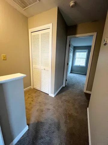 a view of a livingroom with a staircase