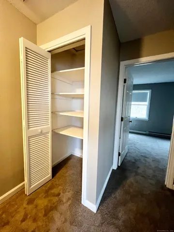 a view of a room with a wardrobe space