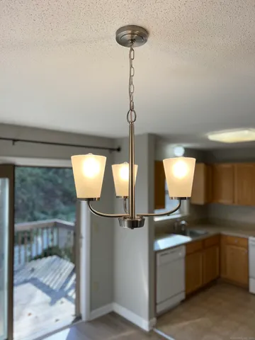 a kitchen with refrigerator and window