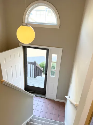 a view of a hallway with windows