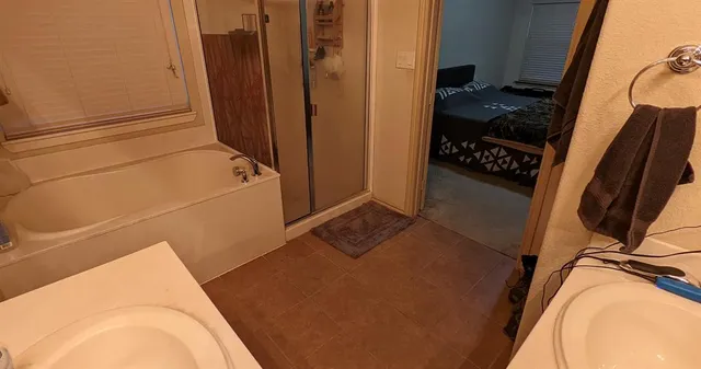 a living room with furniture and a mirror