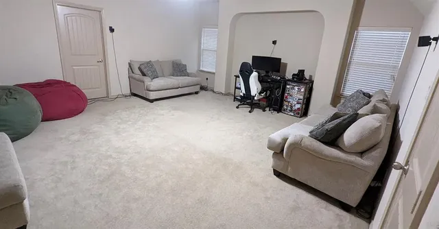 a living room with furniture and a couch